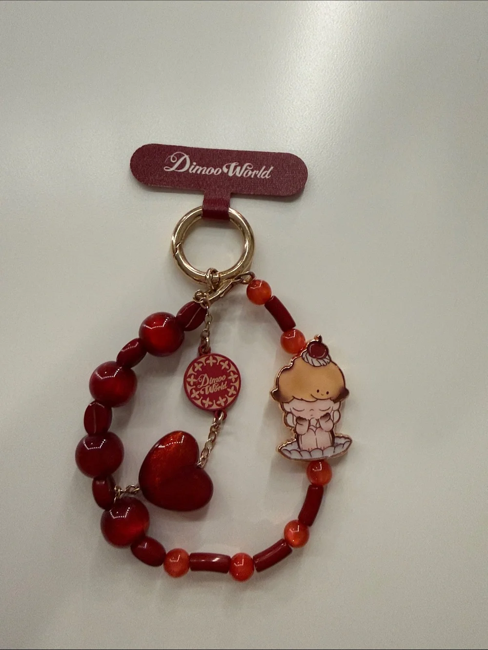 Red Beaded Character Phone Wristlet by Dimoo World